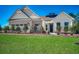 Charming exterior with brick and siding accents, well-manicured lawn, and inviting front entrance at 115 Northbrook Dr, Murrells Inlet, SC 29576