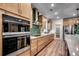 Well-equipped kitchen featuring modern appliances, ample cabinet space, and stylish backsplash for culinary enthusiasts at 115 Northbrook Dr, Murrells Inlet, SC 29576