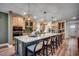 Modern kitchen boasts a large island with seating, pendant lighting, and sleek appliances, perfect for entertaining at 115 Northbrook Dr, Murrells Inlet, SC 29576
