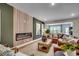 Cozy living room with a contemporary fireplace, comfortable seating, and natural light at 115 Northbrook Dr, Murrells Inlet, SC 29576