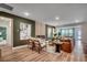 Open-concept living room with a modern fireplace, stylish furnishings, and hardwood floors at 115 Northbrook Dr, Murrells Inlet, SC 29576