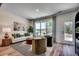 Bright sitting room with a large window, cozy chairs, and modern accents, offering a relaxing view and natural light at 115 Northbrook Dr, Murrells Inlet, SC 29576