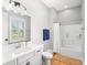 Clean bathroom with modern sink, toilet, shower and natural light from a bright window at 116 Sago Palm Dr., Myrtle Beach, SC 29579