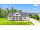 Charming single-Gathering home with a covered front porch and well-manicured lawn at 116 Sago Palm Dr., Myrtle Beach, SC 29579
