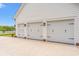 Attached three-car garage with traditional carriage doors on a well maintained modern house at 116 Sago Palm Dr., Myrtle Beach, SC 29579
