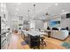 Open-concept kitchen featuring a large island with counter seating and seamless flow to the living area at 116 Sago Palm Dr., Myrtle Beach, SC 29579