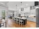 Bright, open-concept kitchen with a large island, white cabinets, and stainless steel appliances at 116 Sago Palm Dr., Myrtle Beach, SC 29579