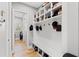 Organized mudroom with built-in storage, cubbies, hooks, and a bench for added convenience at 116 Sago Palm Dr., Myrtle Beach, SC 29579