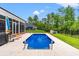 Backyard view of swimming pool, beautiful patio area, and well-maintained yard at 116 Sago Palm Dr., Myrtle Beach, SC 29579