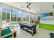 Spacious sunroom featuring a pool table and recreational space for Gathering fun at 116 Sago Palm Dr., Myrtle Beach, SC 29579