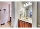 Well-maintained bathroom with wooden cabinets, a vanity with a sink, and tile flooring at 118 Birch N Coppice Dr. # 6, Surfside Beach, SC 29575