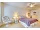 Cozy bedroom with plush carpeting, warm lighting, and a comfortable sitting area next to the bed at 118 Birch N Coppice Dr. # 6, Surfside Beach, SC 29575