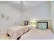 Guest bedroom featuring twin beds, neutral walls, and a ceiling fan for added comfort at 118 Birch N Coppice Dr. # 6, Surfside Beach, SC 29575