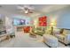 Spacious living room with a ceiling fan, comfortable seating, and a large window offering plenty of natural light at 118 Birch N Coppice Dr. # 6, Surfside Beach, SC 29575