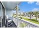 Relaxing balcony with seating, offering a view of the street and nearby buildings at 1210 N Ocean Blvd. # 104, Surfside Beach, SC 29575
