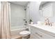 Modern bathroom featuring a shower over tub with marble-look tile and brushed gold fixtures at 1210 N Ocean Blvd. # 104, Surfside Beach, SC 29575
