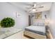 Bright bedroom features coastal decor, a comfortable bed, and lots of natural light at 1210 N Ocean Blvd. # 104, Surfside Beach, SC 29575