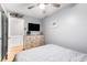 Bedroom features a ceiling fan, a large dresser, and a flat screen TV at 1210 N Ocean Blvd. # 104, Surfside Beach, SC 29575