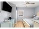 Comfortable bedroom featuring a well-lit space with ample storage and a ceiling fan at 1210 N Ocean Blvd. # 104, Surfside Beach, SC 29575