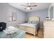 Serene bedroom with natural light, comfortable bed, and ample storage with a dresser at 1210 N Ocean Blvd. # 104, Surfside Beach, SC 29575