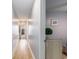 Hallway featuring beautiful, light colored wood floors and stylish beach themed decor at 1210 N Ocean Blvd. # 104, Surfside Beach, SC 29575