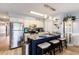 Modern kitchen with granite countertops, stainless steel appliances, a breakfast bar, and pendant lighting at 1210 N Ocean Blvd. # 104, Surfside Beach, SC 29575