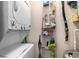 Laundry area with stacked washer/dryer and shelving for storage at 1210 N Ocean Blvd. # 104, Surfside Beach, SC 29575