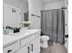 Bathroom featuring a white vanity, black hardware and a shower with a gray curtain at 1216 Newell Dr, Myrtle Beach, SC 29588