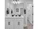Modern bathroom with double vanity, black fixtures and a large mirror at 1216 Newell Dr, Myrtle Beach, SC 29588