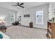 bedroom with neutral tones, two windows, a ceiling fan and a seating area at 1216 Newell Dr, Myrtle Beach, SC 29588