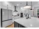Kitchen featuring white cabinets, a large island with counter seating, and stainless steel appliances at 1216 Newell Dr, Myrtle Beach, SC 29588