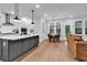 Open-concept kitchen and dining area with a large island, modern appliances, and plenty of natural light at 1216 Newell Dr, Myrtle Beach, SC 29588