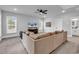 Large living room with a comfortable sectional sofa, ceiling fan and plenty of natural light at 1216 Newell Dr, Myrtle Beach, SC 29588
