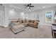 A spacious living room with neutral walls, carpet floors, and a comfortable sectional sofa at 1216 Newell Dr, Myrtle Beach, SC 29588