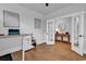 Bright home office with wood floors, french doors, neutral walls and modern decor at 1216 Newell Dr, Myrtle Beach, SC 29588
