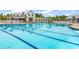 Large community pool with lane lines reflecting clubhouse in beautiful neighborhood at 1216 Newell Dr, Myrtle Beach, SC 29588