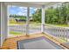 Inviting porch with wood floors and a view of the neighborhood amenities at 1216 Newell Dr, Myrtle Beach, SC 29588