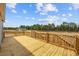 Expansive wooden deck perfect for entertaining, with views of the surrounding trees and neighborhood at 1301 Rabbit Ln., Conway, SC 29526