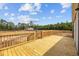 Spacious wooden deck offering serene views of the surrounding greenery and neighborhood at 1301 Rabbit Ln., Conway, SC 29526