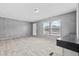 Spacious living room with wood-look flooring and lots of natural light at 1301 Rabbit Ln., Conway, SC 29526