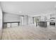 Open-concept living area seamlessly connecting the living room, dining space, and modern kitchen with island and stainless appliances at 1301 Rabbit Ln., Conway, SC 29526