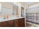 Bathroom featuring dual sinks with vanity and shower tub combo with patterned curtain at 144 Baylee Circle, Aynor, SC 29544