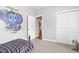 Charming bedroom with painted elephant, closet, and an open door showcasing hardwood floors at 144 Baylee Circle, Aynor, SC 29544