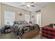 Inviting bedroom boasts natural light, moose themed décor, and attached bathroom at 144 Baylee Circle, Aynor, SC 29544