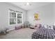 Adorable bedroom with painted Pooh character, a window with floral accents, and a ceiling fan at 144 Baylee Circle, Aynor, SC 29544