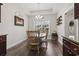Dining area with wood table set and natural light, adjacent to the kitchen for easy access at 144 Baylee Circle, Aynor, SC 29544