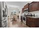 Dining room features wood floors, tray ceilings, and a window view; seamlessly connects to the kitchen at 144 Baylee Circle, Aynor, SC 29544
