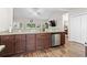 Stylish kitchen with breakfast bar, wood cabinets, granite countertops, and stainless steel appliances at 144 Baylee Circle, Aynor, SC 29544