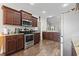 Well-equipped kitchen boasts stainless steel appliances, granite countertops, and ample cabinet space at 144 Baylee Circle, Aynor, SC 29544