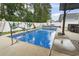 Sparkling pool in fenced yard with metal railing, tropical decor and cozy outdoor space at 144 Baylee Circle, Aynor, SC 29544